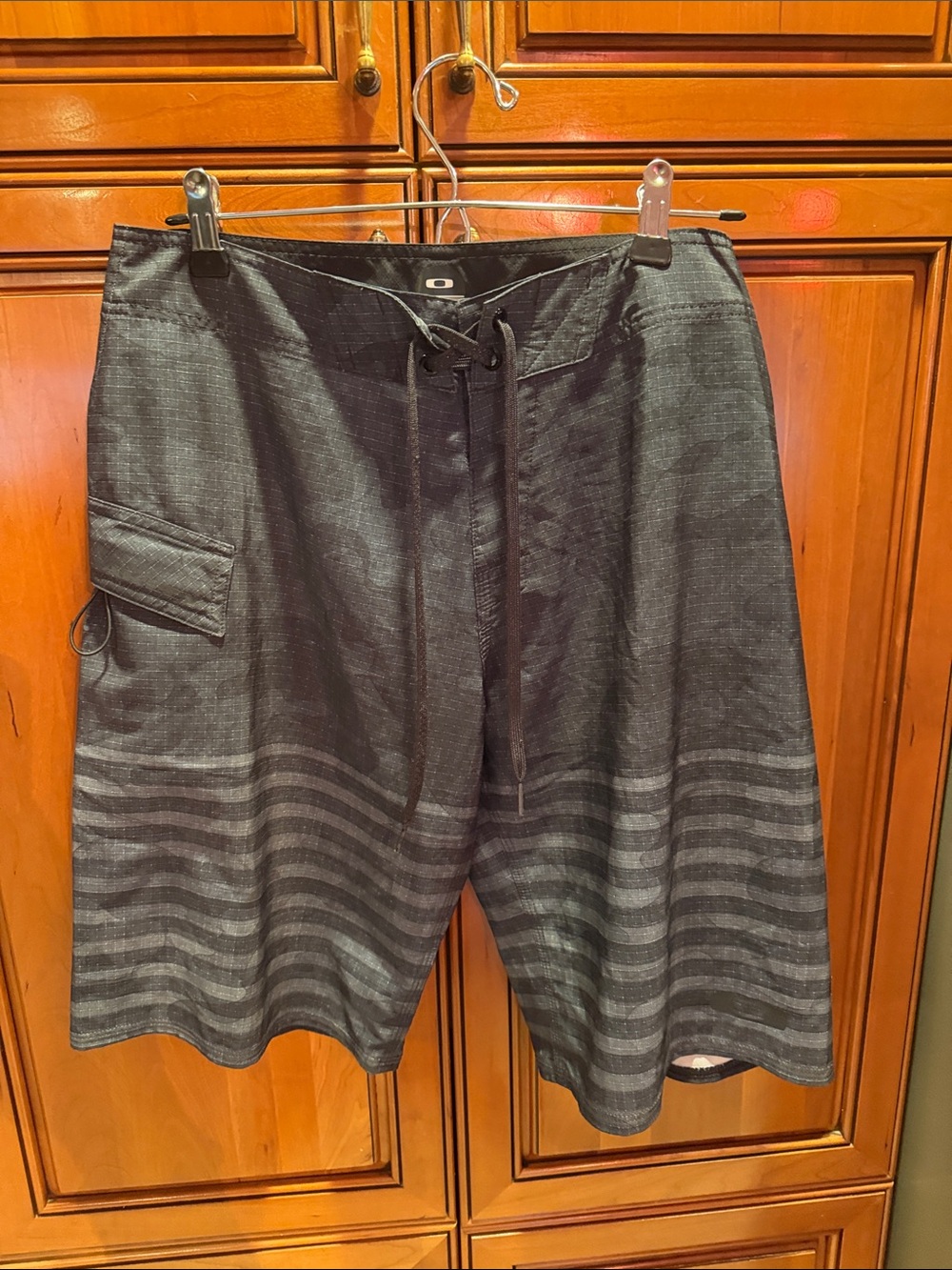 Oakley Black Board Shorts with Subtle Gray Stripes